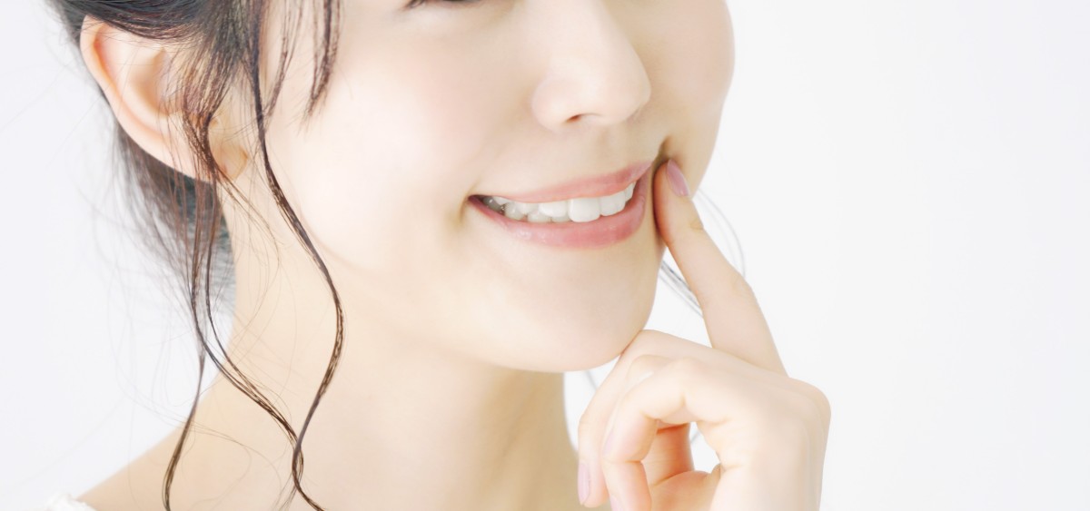 審美歯科治療で歯が綺麗になった女性